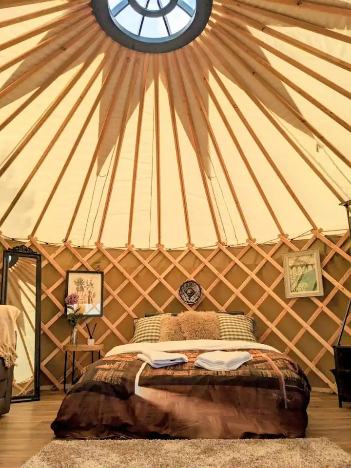 Glamping yurt interior with bed